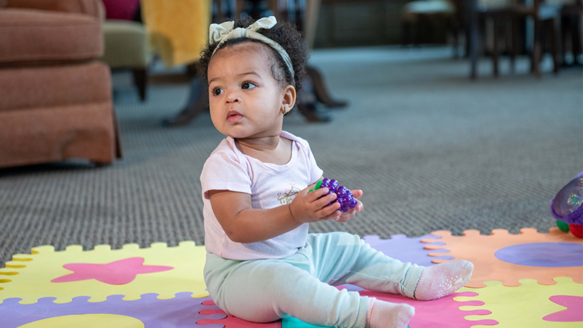 baby holding toy
