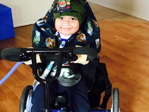 Francisco on his tricycle.