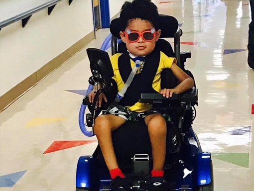 Francisco at the hospital getting around in his power chair.
