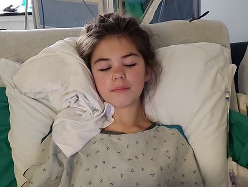 Kaitlin relaxing in bed
