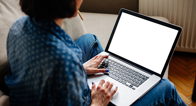 FAQ Woman using laptop