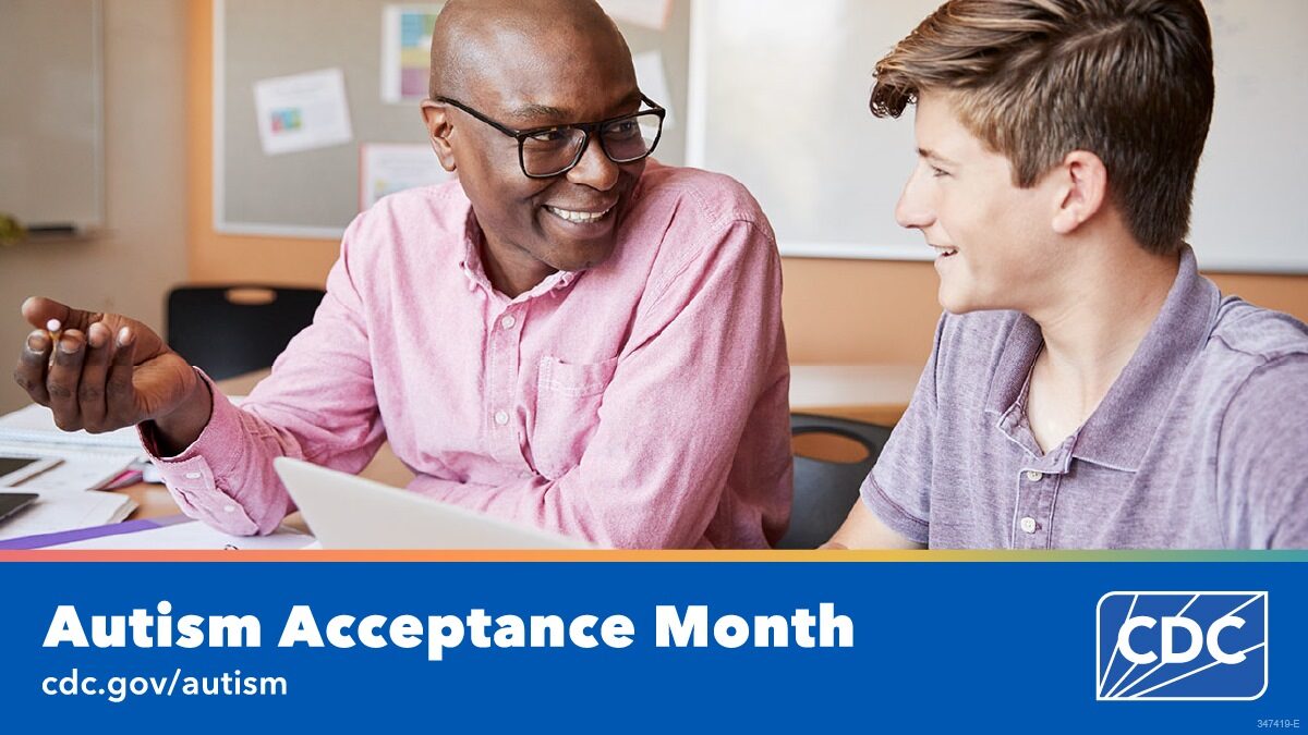 A high school teacher helps a student complete their homework on a laptop. Text overlay reads, “Autism Acceptance Month. cdc dot gov slash autism”