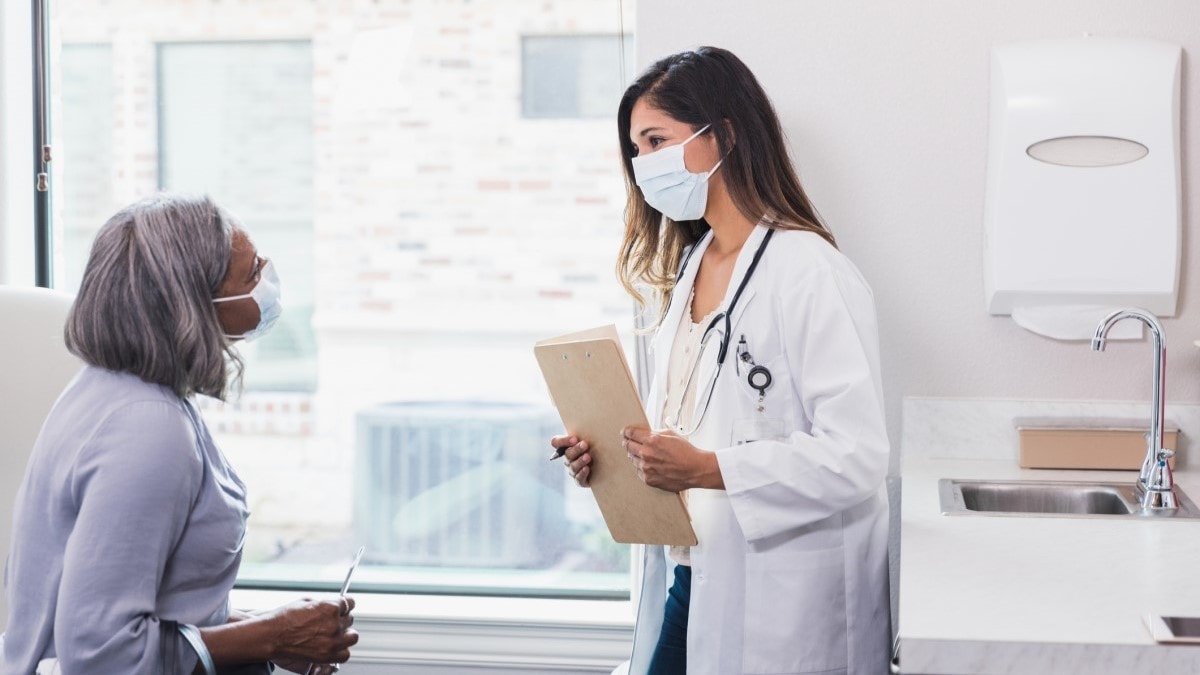 Photo of a patient talking to her doctor