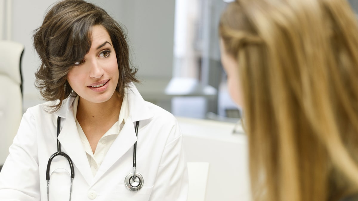 a doctor talking to a patient