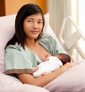 mpinc-breastfeeding-mother_285px A breastfeeding mother in her hospital bed.