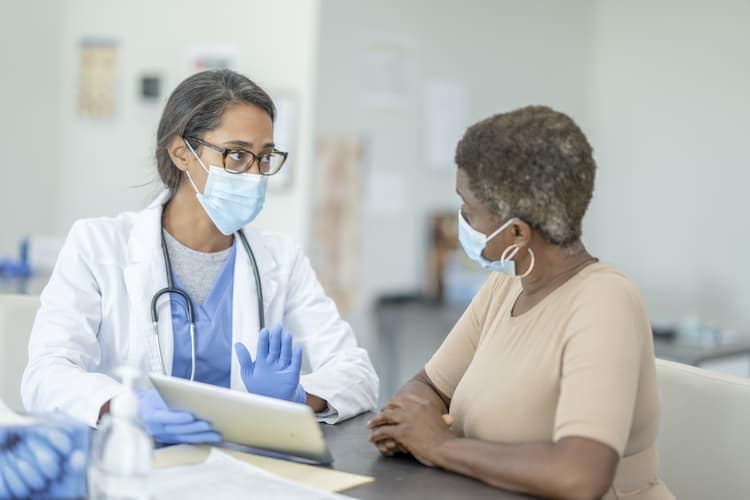 Photo of a woman talking to her doctor