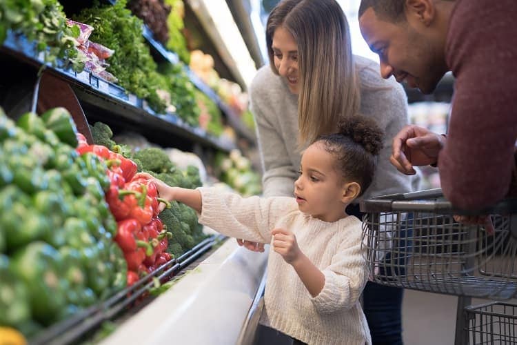 A family buying groceries
