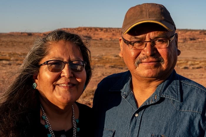 American Indians and Alaska Natives (AI/AN) Photo of a Native American husband and wife near their home in Monument Valley, Utah.