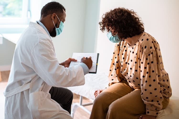 Photo of a woman and her gynecologist