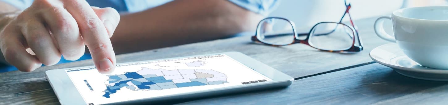 Photo of a person looking at data about HPV on a tablet computer