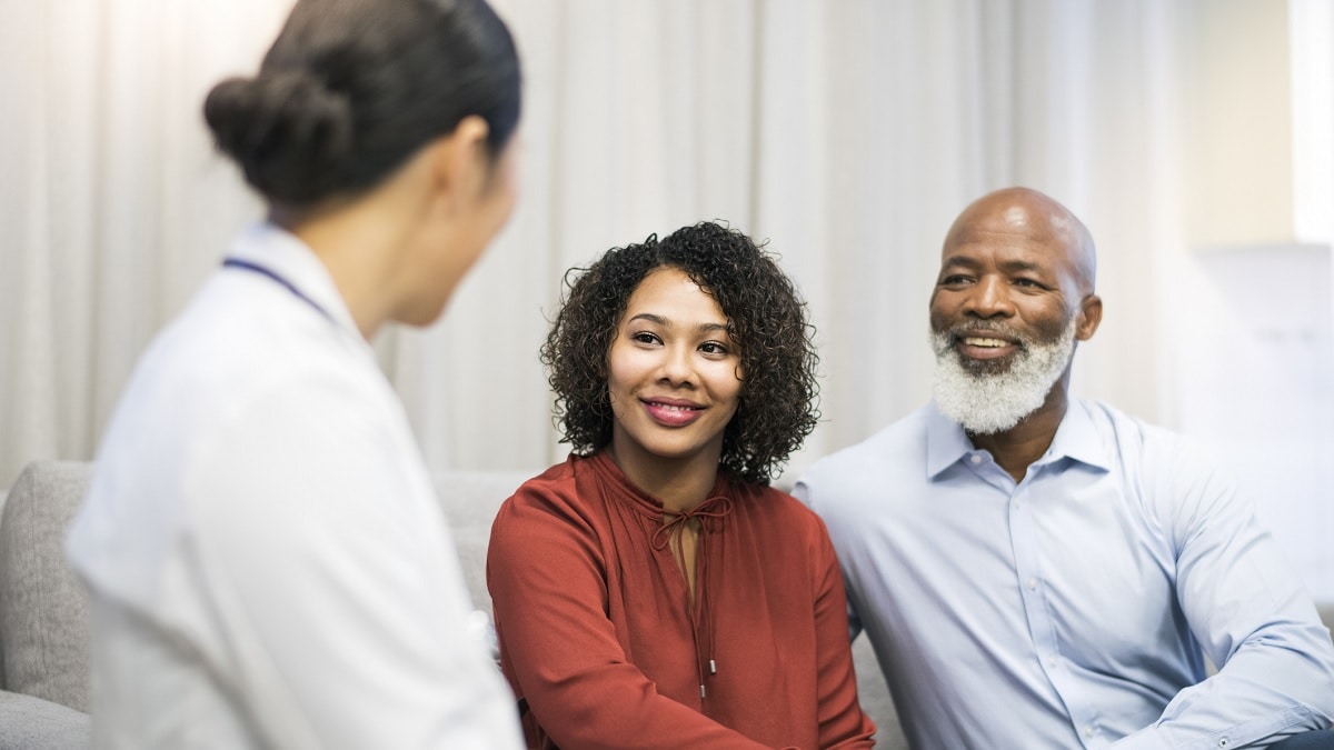 doctor 2patients A doctor talking to a man and a woman