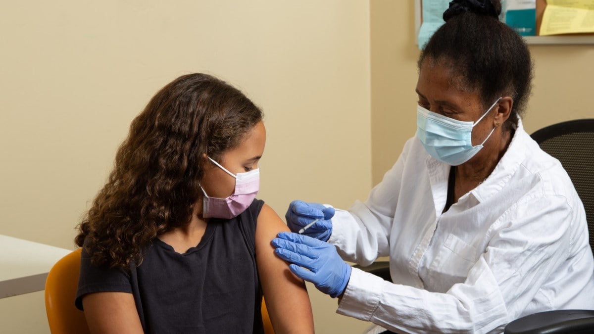 Vaccine a doctor giving an HPV vaccine to a girl