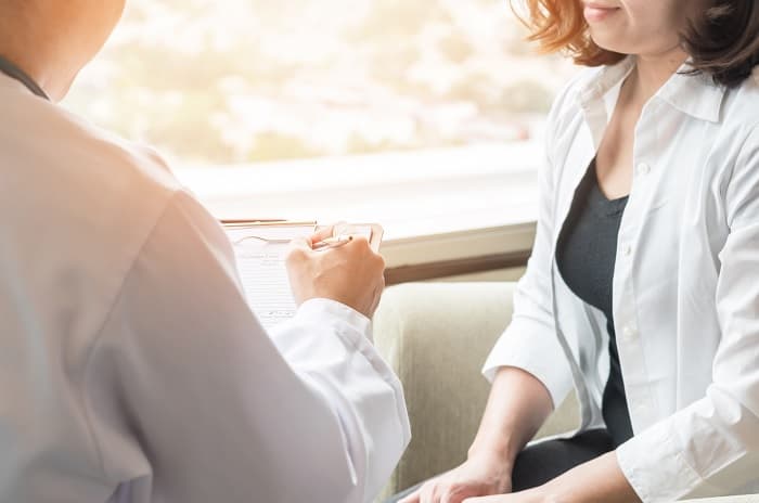 Photo of a doctor talking to a patient
