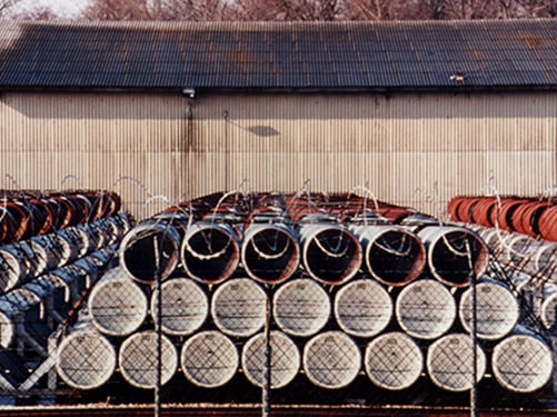 Ton Containers of Mustard Agent Bulk containers of chemical agent stored outside.