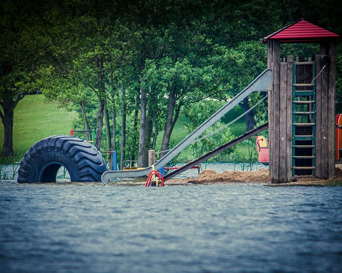 Floodwaters on kids playground Floodwaters on kids playground