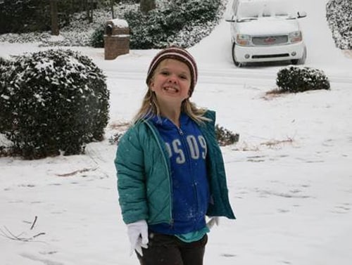 Maya-smiling-snow-500px.jpg Maya in the snow smiling