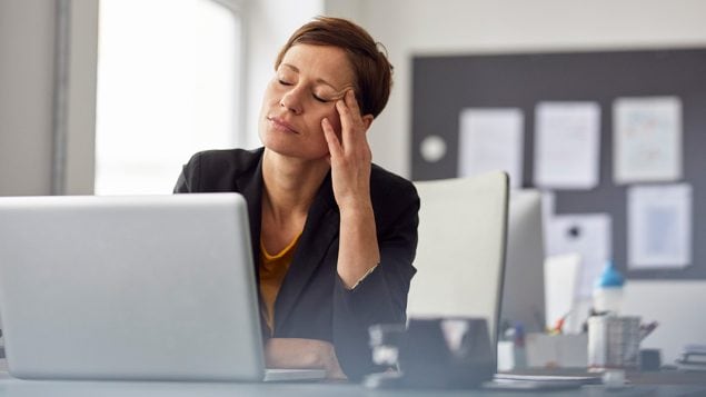 Woman sitting at desk Woman sitting at desk