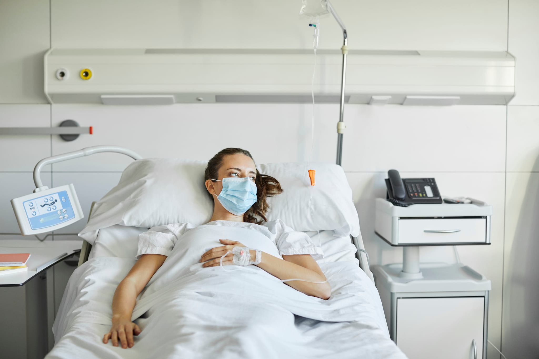 Woman lying in hospital bed Woman lying in hospital bed.
