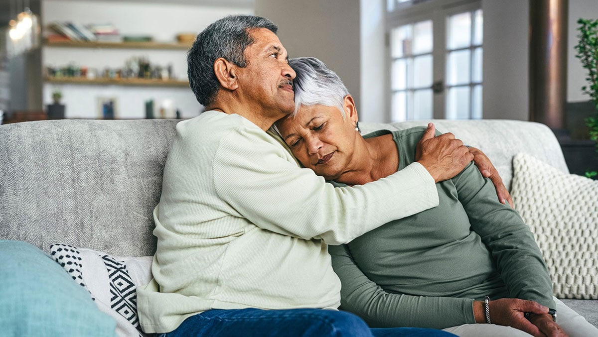 Shot of a senior man supporting his wife during a difficult time at home an older man sitting and thinking