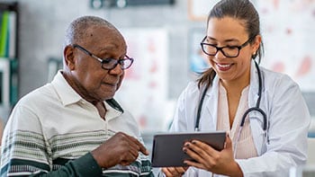 GettyImages-blood-sugar-main older man talking to doctor