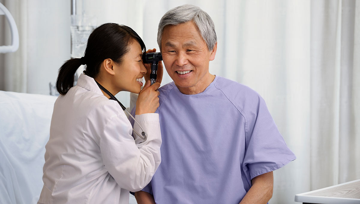 ear-doctor-image-cr Doctor looking in a patients ear