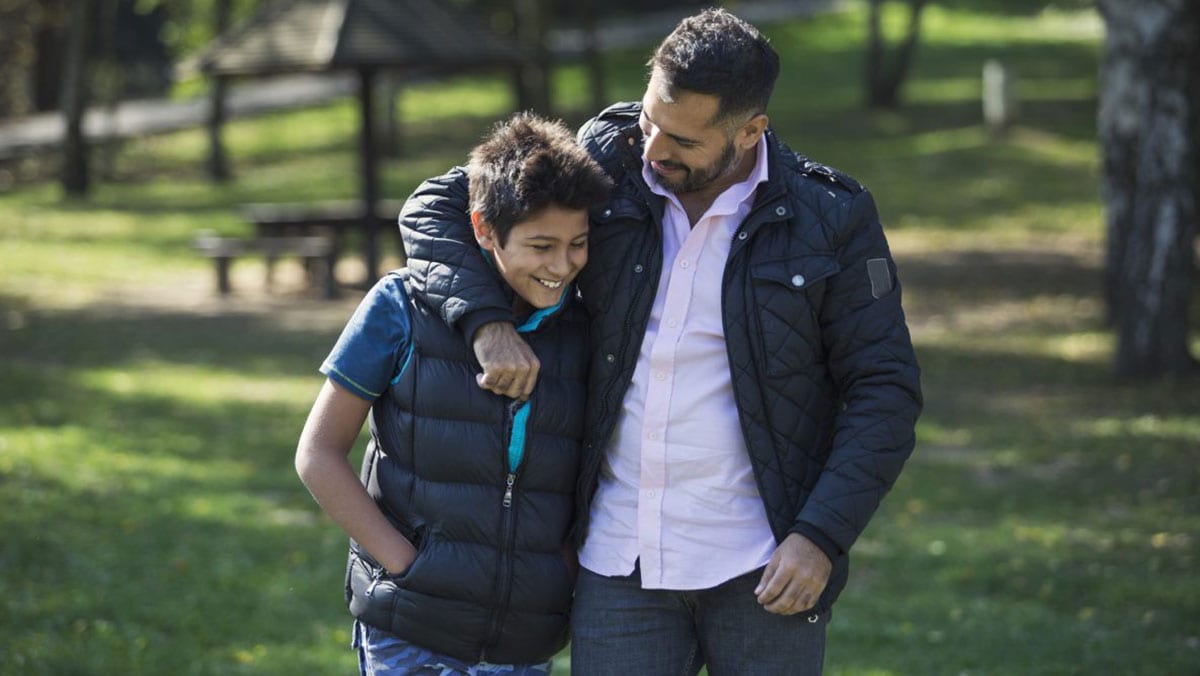 GettyImages925672792abouttype1.jpg man hugging his son
