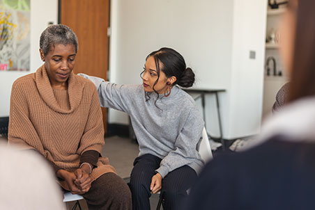 GettyImages-1173939468-cr somebody comforting someone in a group setting