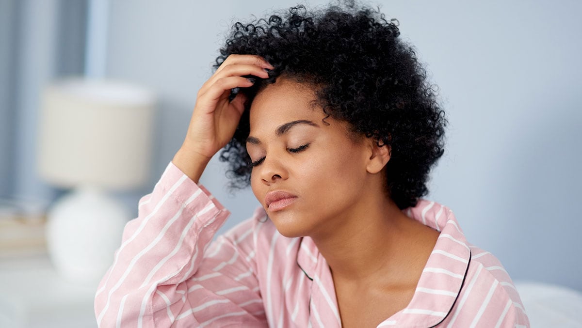 stressed out looking woman in pajamas