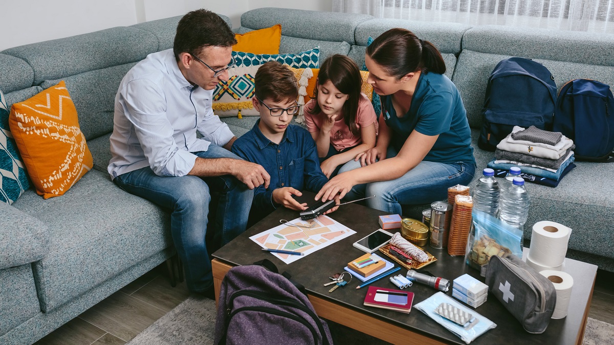 A family working on an emergency kit
