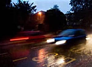disasters_drivesafely02-300x219 Car Driving on Dark, Wet Road
