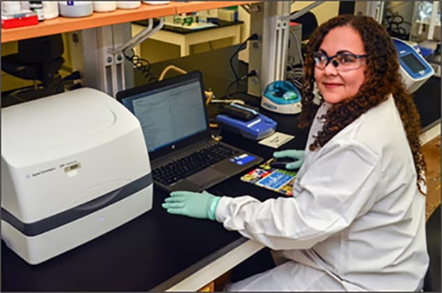 Brunie Burgos White, PhD, an LLS Fellow with CDC’s Division of STD Prevention, conducts laboratory work.