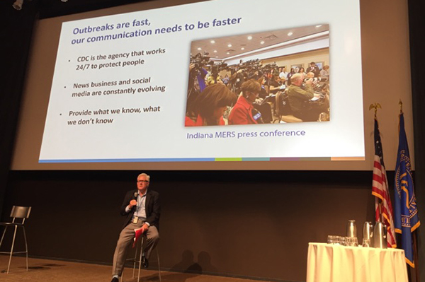 speaker giving presentation on outbreaks