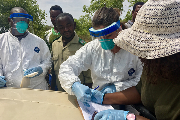 EIS officer recording data from field location