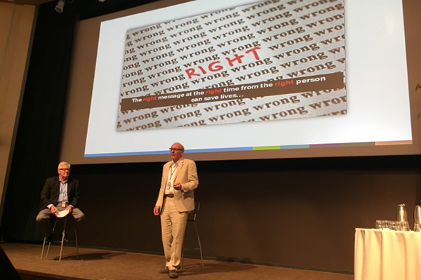 speaker giving presentation on stage