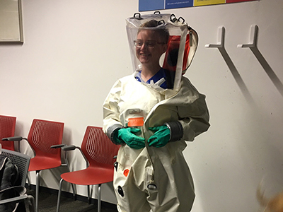 Dr. Jesse Whitfield in hazmat suit