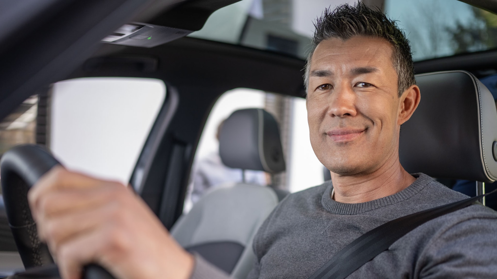 A man driving a car A man driving a car