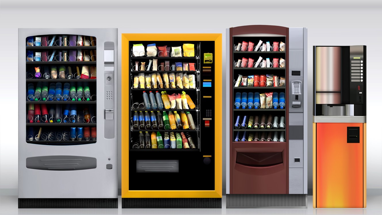 Three vending machines and a coffee station.
