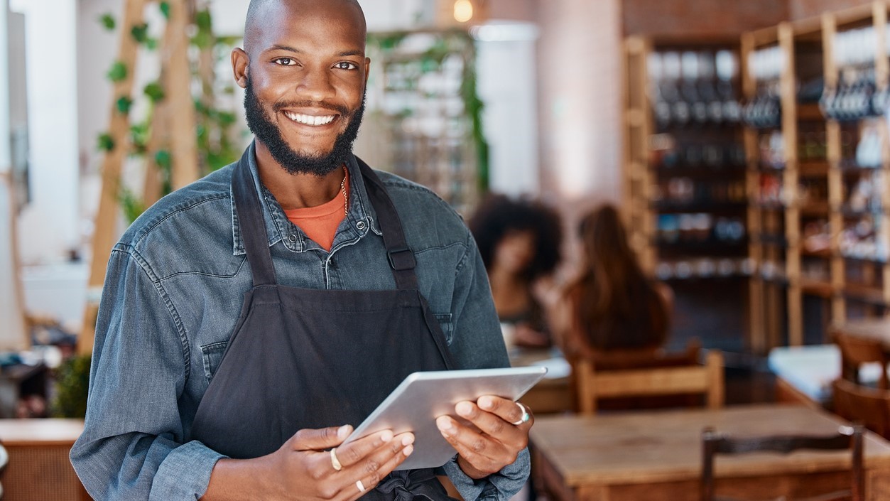 Man in cafe doing an assessment.