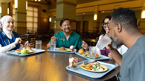Healthcare professionals eating in hospital cafeteria