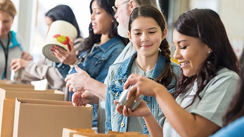 — title missing — Volunteers unloading donations at food pantry.