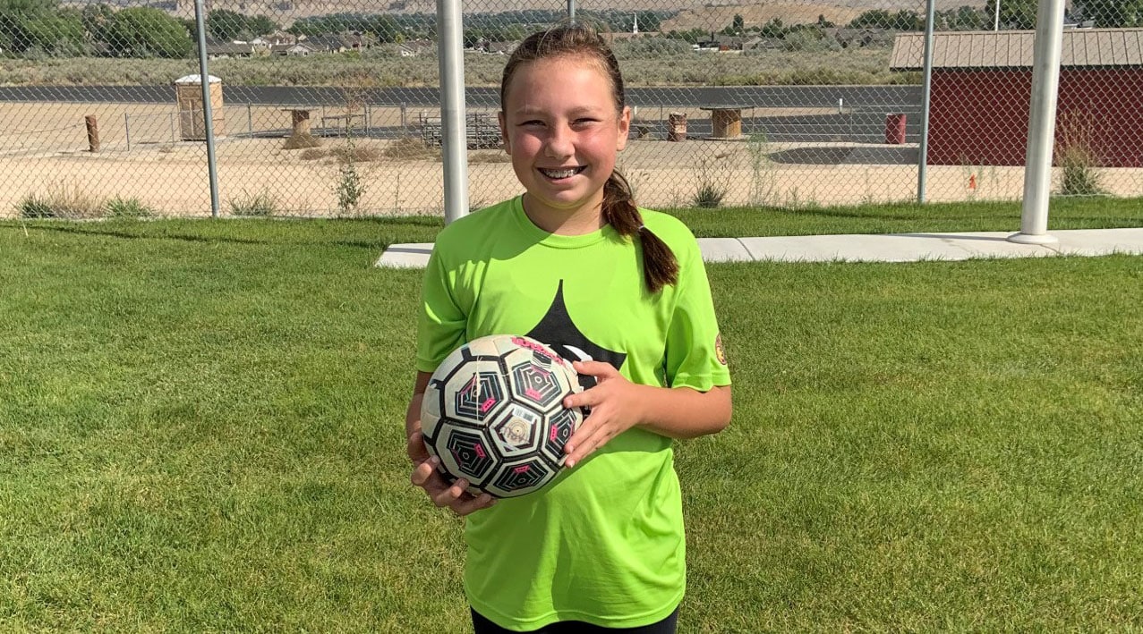 Harlee playing soccer