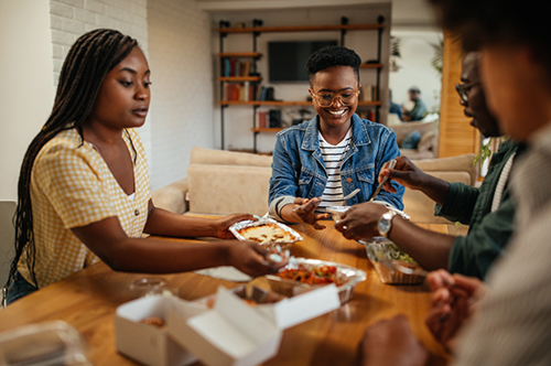 Family sitting down for supper.