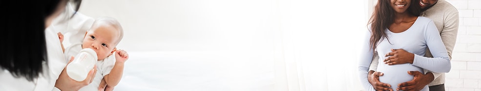 A woman bottle feeding her baby