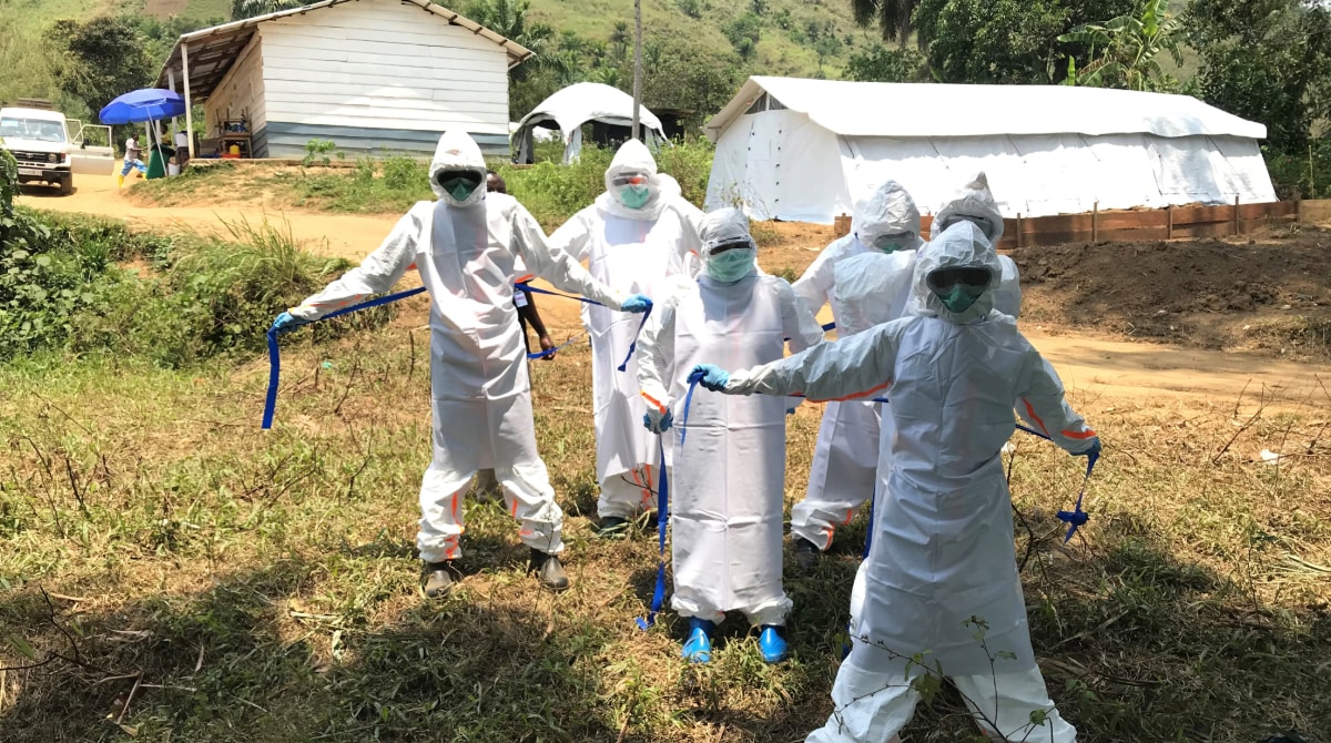 Ebola DRC PPE Five public health workers dressed in personal protective equipment during the Ebola response in Congo.