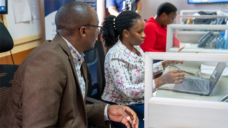 Man talking to a lady on the computer