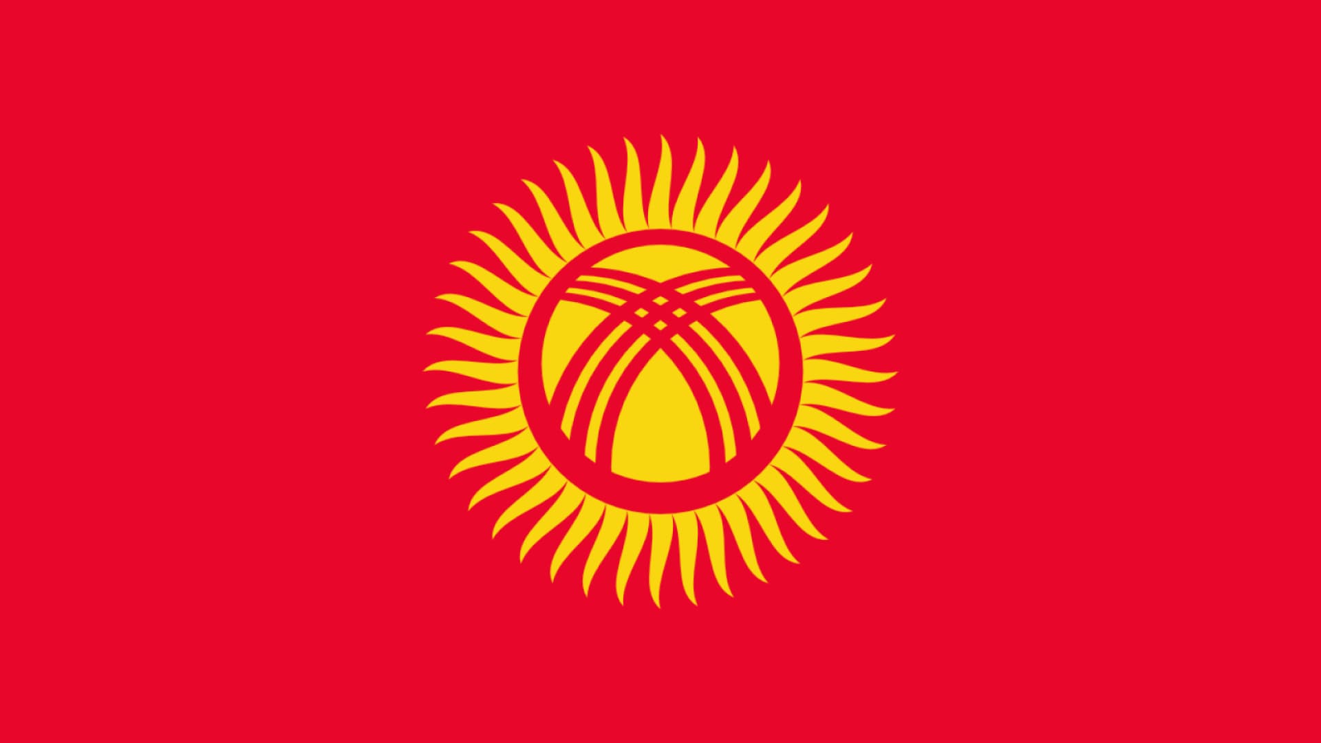 Kyrgyzstan flag is red with a gold sun in the center.