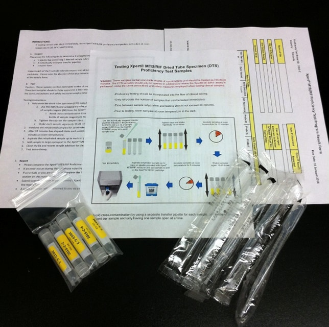 2024_SuccessStory_WTBD A pamphlet, vials, and materials that are included in an Xpert TB Proficiency Testing program sample kit.