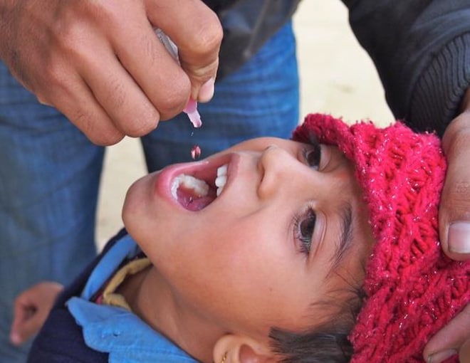 Child receiving polio vaccine