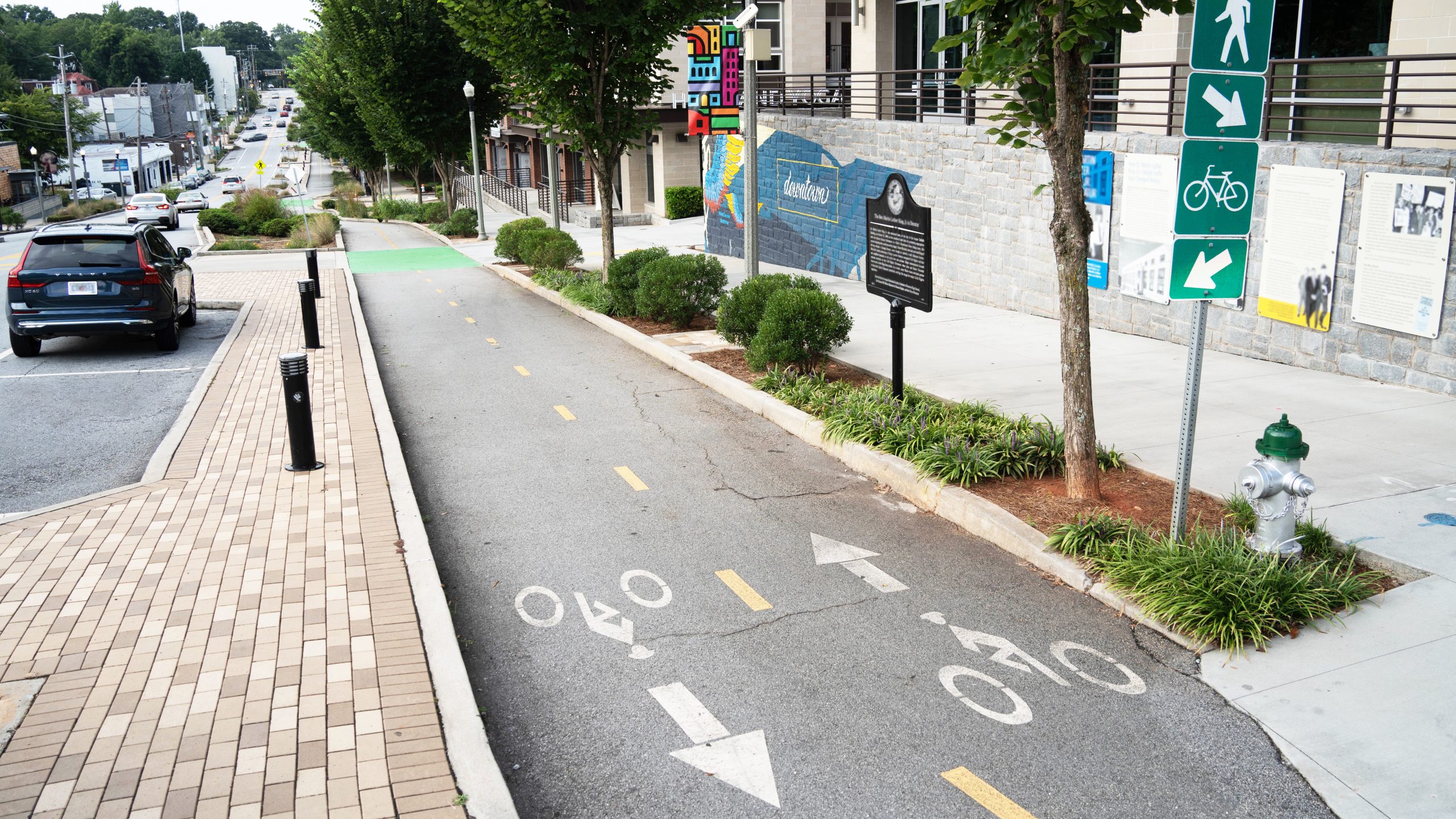 Walkable City A city street, bike lane, and wide sidewalk.