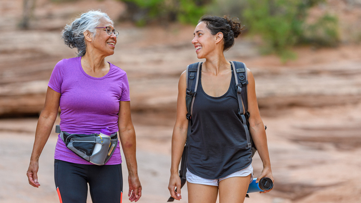 Going for a hike Two women walking in a desert